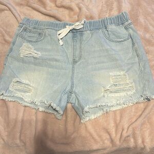 Distressed athletic denim shorts
